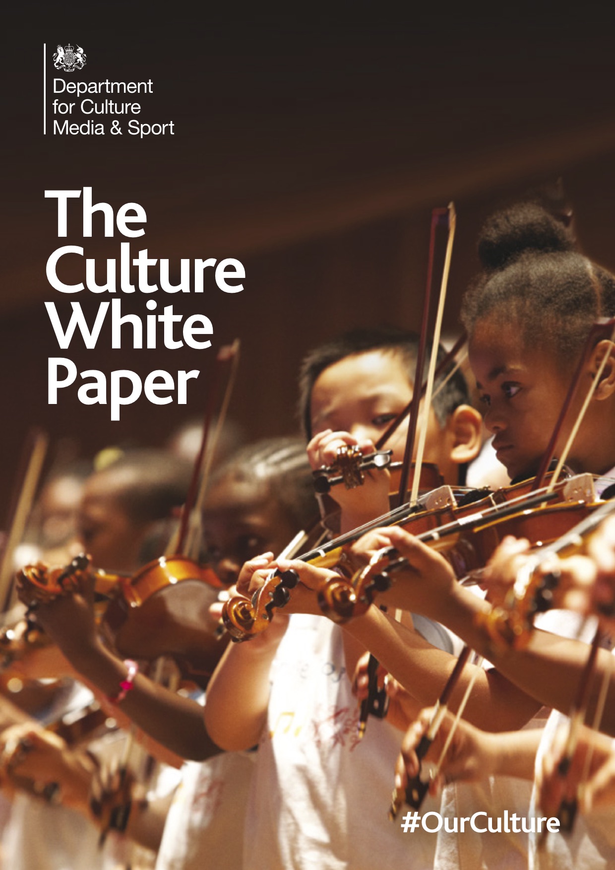 "The Culture White Paper: #OurCulture" a report from the Government Department for Culture, Media and Sport. Cover art is a group of ethnically diverse children learning to play violin in school uniforms.